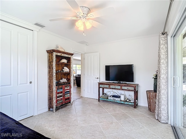 living room with ceiling fan and crown molding