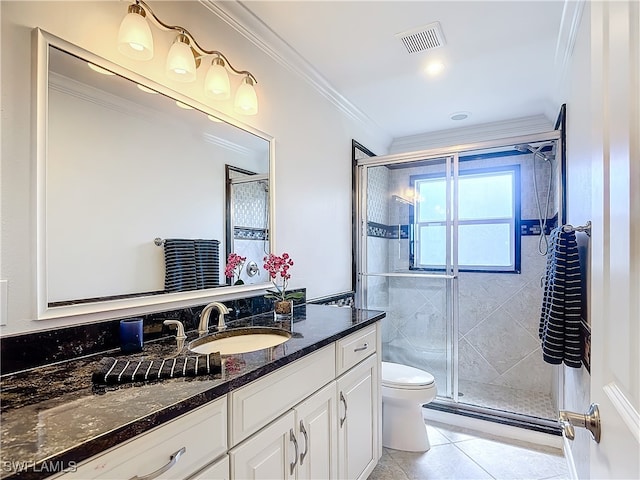 bathroom featuring vanity, ornamental molding, a shower with shower door, tile patterned floors, and toilet