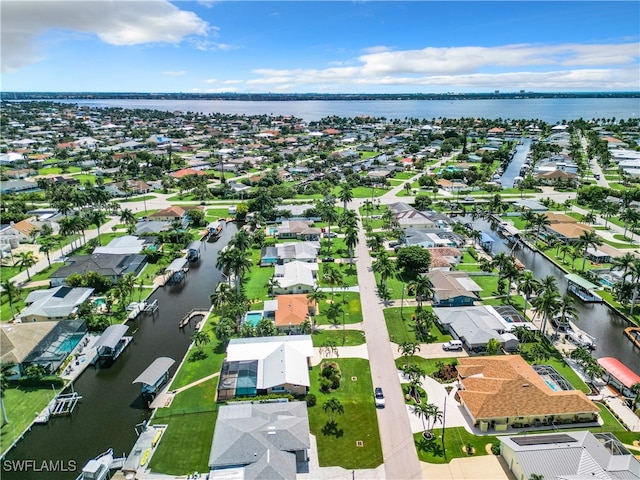 birds eye view of property featuring a water view