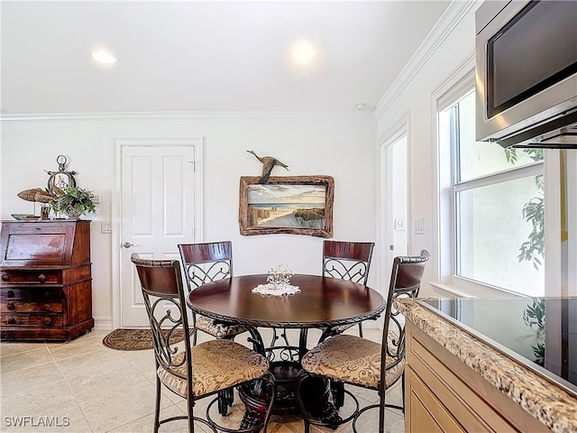 tiled dining area with crown molding