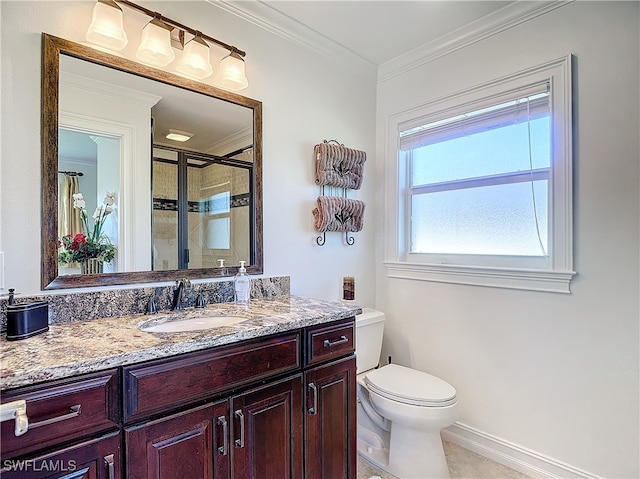 bathroom with vanity, tile patterned flooring, a shower with shower door, crown molding, and toilet