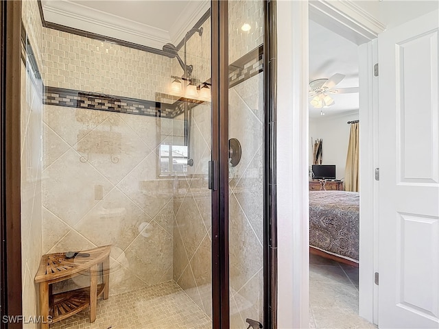 bathroom with tile walls, ceiling fan, an enclosed shower, and crown molding