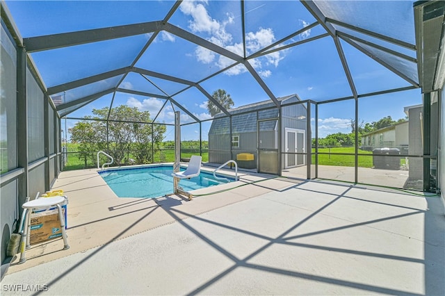 view of swimming pool with glass enclosure, an outdoor structure, and a patio area