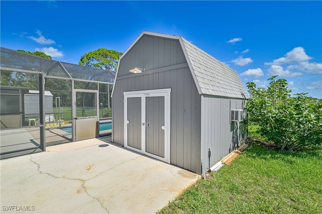 view of outbuilding with a yard