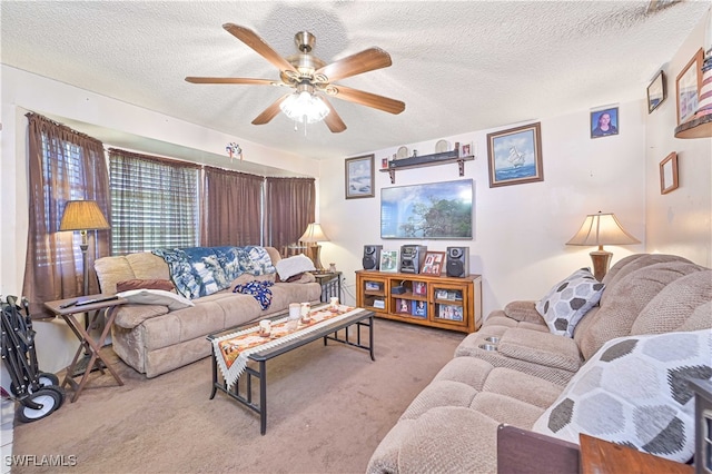 carpeted living room with ceiling fan and a textured ceiling