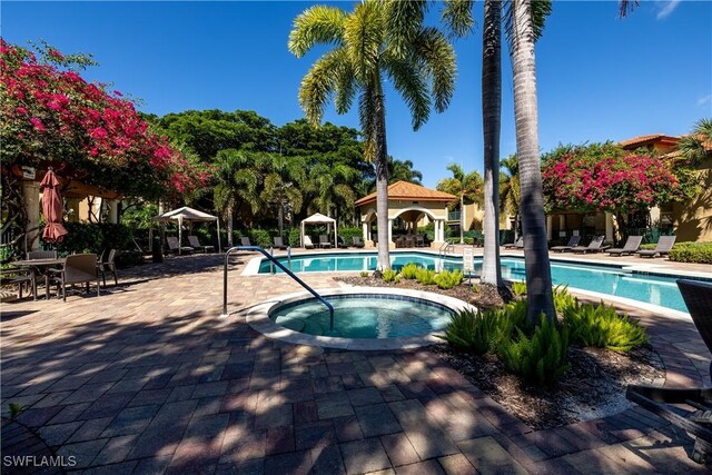 view of pool with a hot tub, a patio, and a gazebo