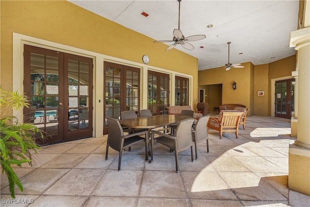 view of patio with french doors and ceiling fan