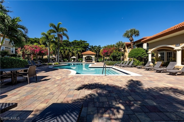 view of pool featuring a gazebo and a patio