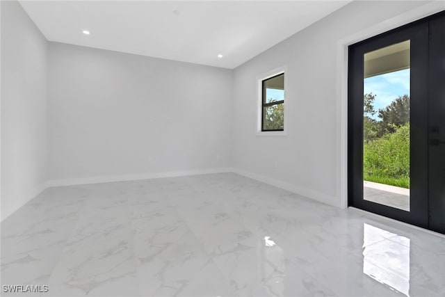 spare room with plenty of natural light