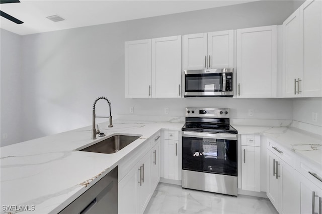 kitchen featuring white cabinetry, sink, and stainless steel appliances