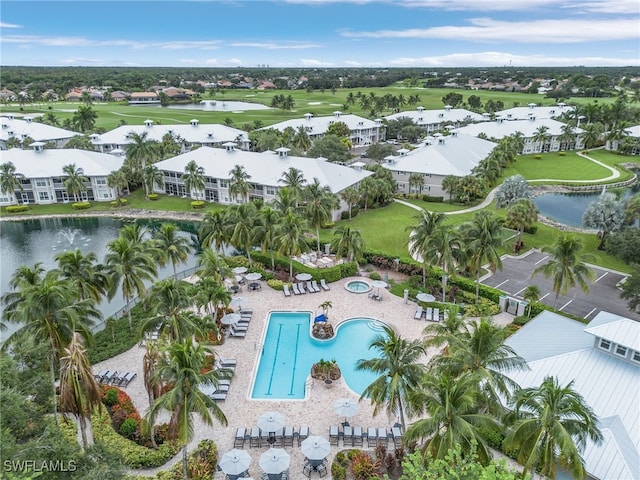 birds eye view of property with a water view