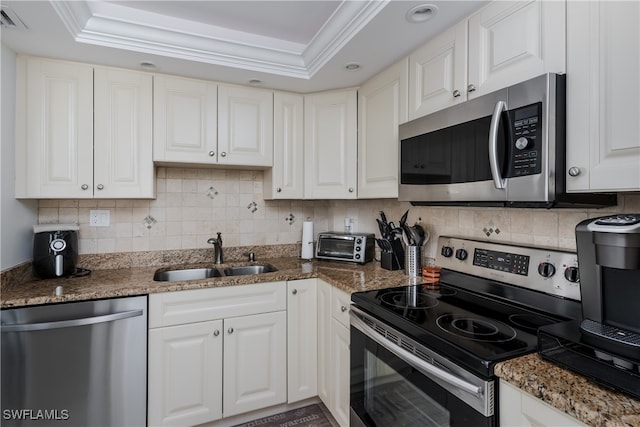 kitchen with white cabinets, stainless steel appliances, and sink