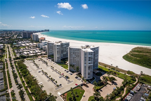 birds eye view of property featuring a view of the beach and a water view