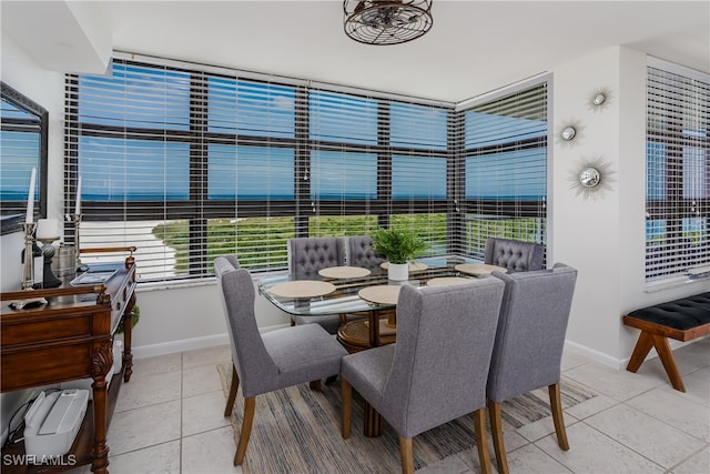 dining room with a healthy amount of sunlight and tile patterned floors