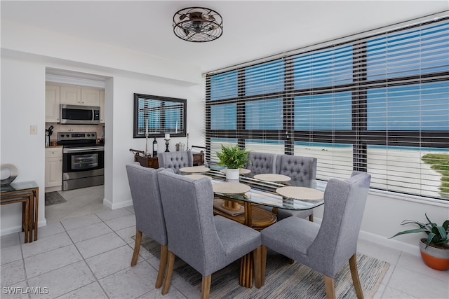 dining room featuring light tile patterned flooring