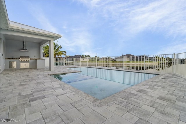 view of pool featuring a patio, area for grilling, fence, and grilling area