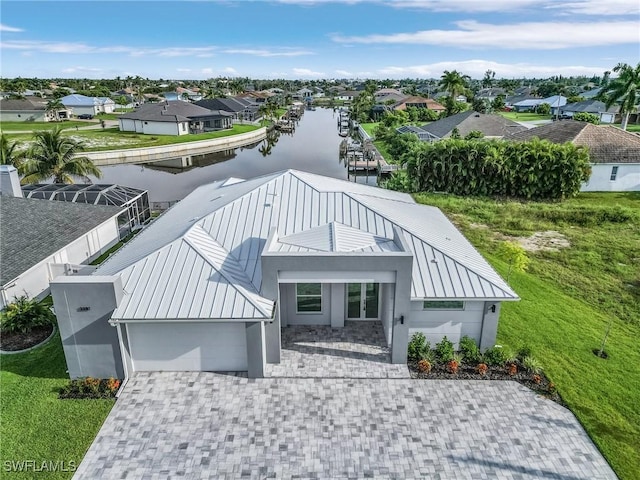 aerial view with a water view and a residential view