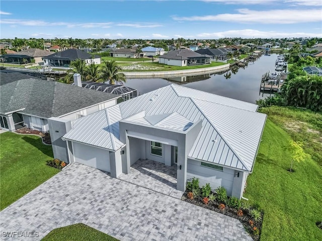 birds eye view of property featuring a residential view and a water view