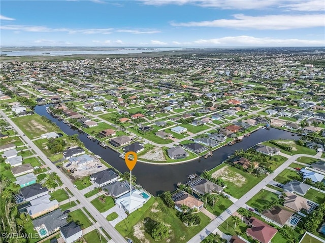 aerial view with a residential view and a water view