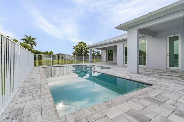 view of pool featuring a patio, a fenced backyard, and a fenced in pool