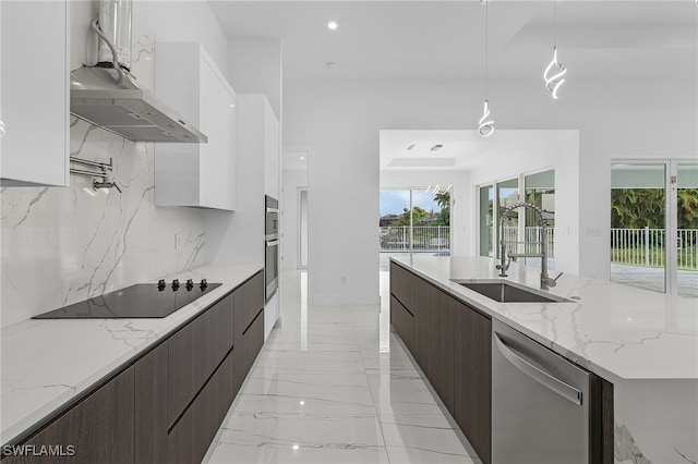 kitchen with decorative light fixtures, black electric stovetop, stainless steel dishwasher, and white cabinetry