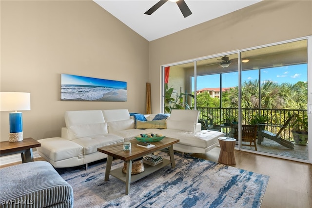 living room with high vaulted ceiling, a ceiling fan, and wood finished floors