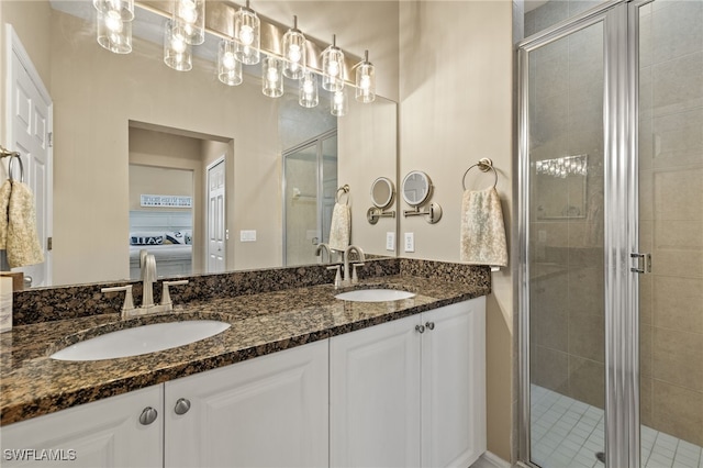 bathroom featuring vanity and an enclosed shower