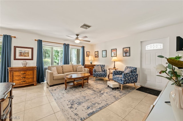 living room with light tile patterned flooring and ceiling fan