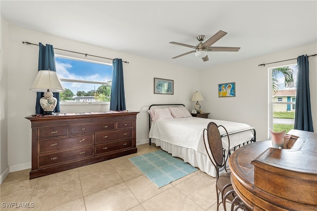 tiled bedroom with ceiling fan