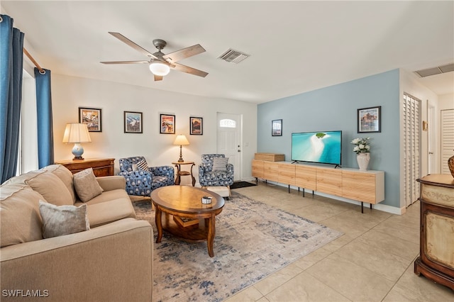 living room featuring ceiling fan and light tile patterned flooring