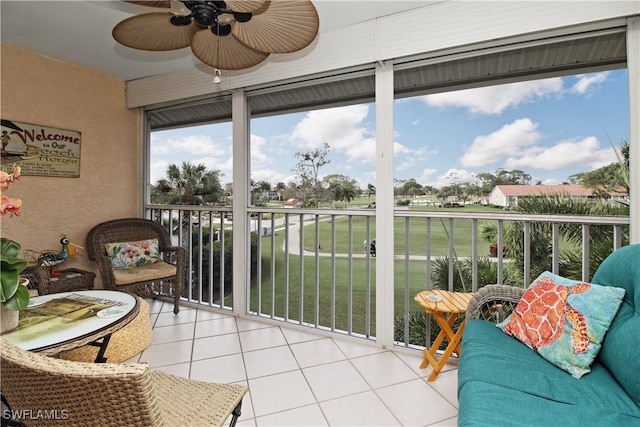 sunroom featuring ceiling fan