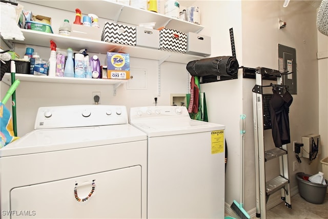 laundry area featuring washing machine and clothes dryer and electric panel