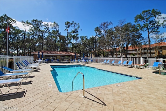 view of swimming pool featuring a patio area