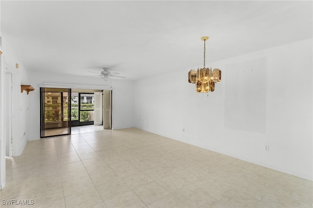 tiled empty room featuring ceiling fan with notable chandelier