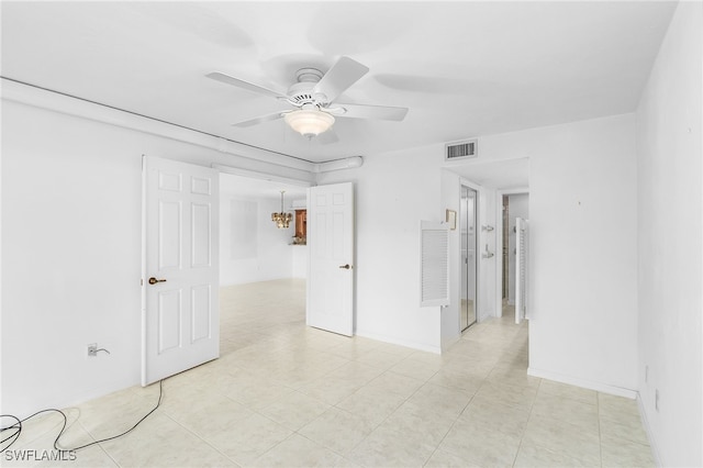 unfurnished bedroom with light tile patterned floors and ceiling fan