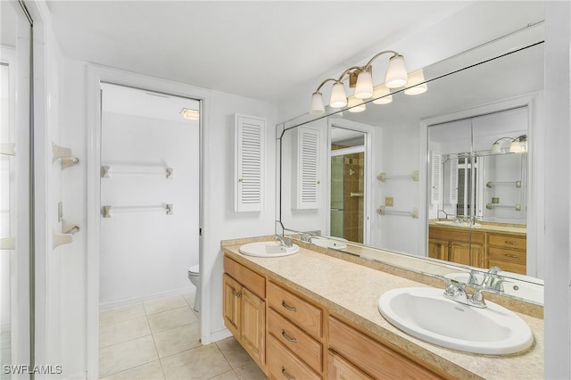 bathroom with walk in shower, vanity, toilet, and tile patterned floors