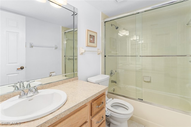 full bathroom featuring vanity, toilet, and combined bath / shower with glass door