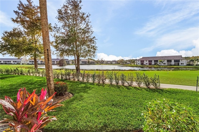 exterior space featuring a water view and a yard