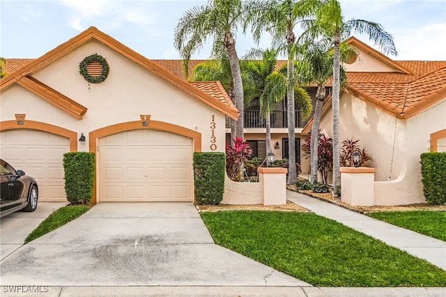 mediterranean / spanish-style home with a garage