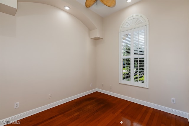 spare room with ceiling fan and wood-type flooring