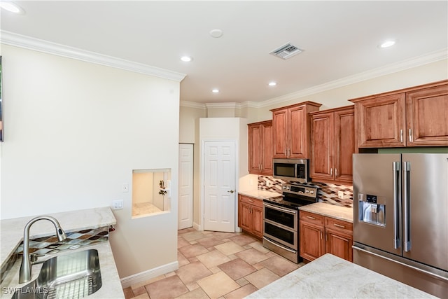 kitchen with sink, stainless steel appliances, light stone counters, decorative backsplash, and ornamental molding