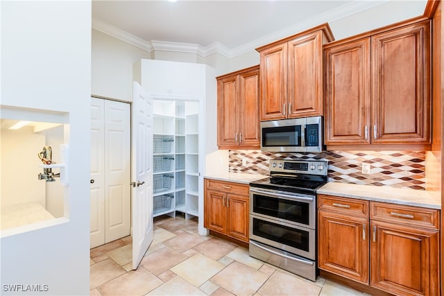 kitchen featuring backsplash, crown molding, stainless steel appliances, and light stone counters