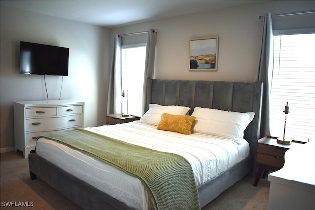 bedroom featuring light carpet