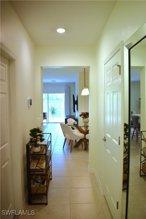 corridor with light tile patterned floors