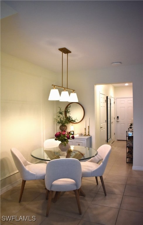 dining space with tile patterned flooring