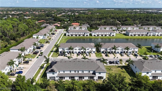 bird's eye view with a residential view and a water view