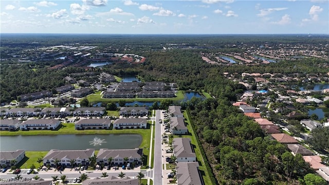 birds eye view of property with a water view and a residential view