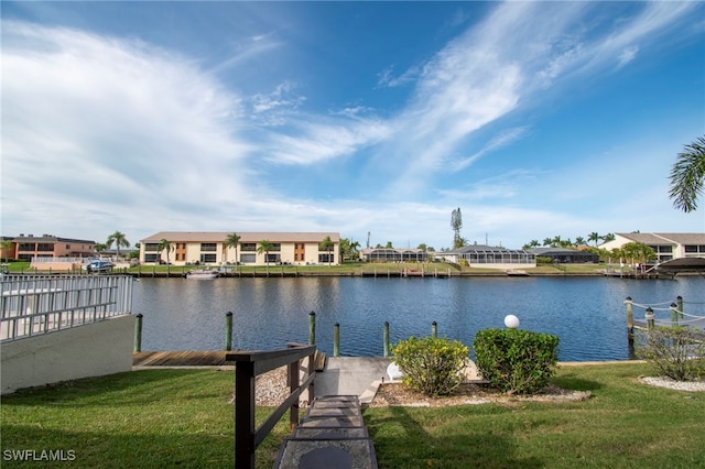 dock area featuring a yard and a water view