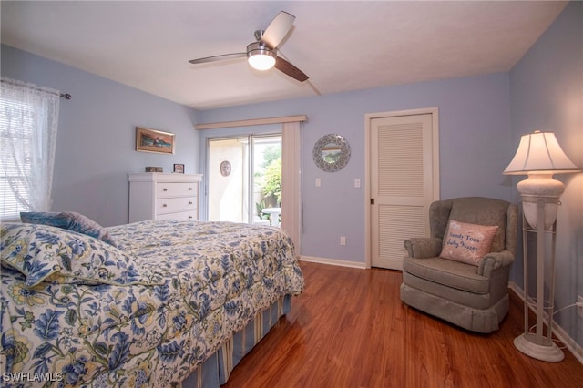 bedroom with access to outside, hardwood / wood-style floors, and ceiling fan