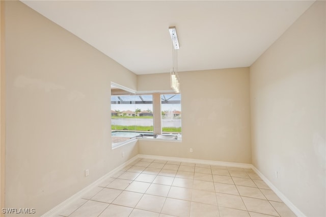 empty room with light tile patterned floors